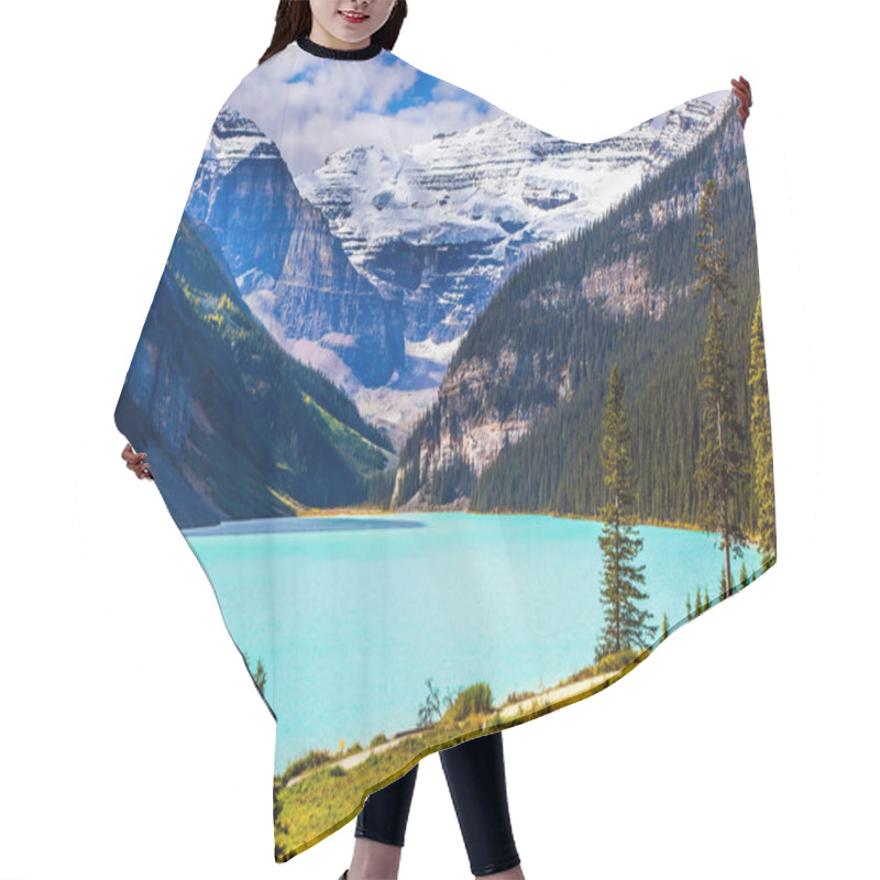 Personality  Travel To The Rocky Mountains Of Canada. The Lake With Azure Water Is Surrounded By Mountains And Forests. Glacial Lake Louise. Sunny Fine Day. The Concept Of Ecological, Active And Photo Tourism Hair Cutting Cape