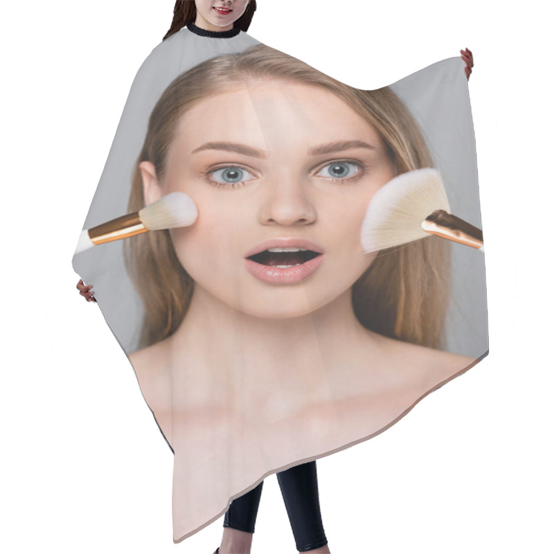 Personality  Amazed Young Woman Holding Cosmetic Brushes Near Face Isolated On Grey Hair Cutting Cape