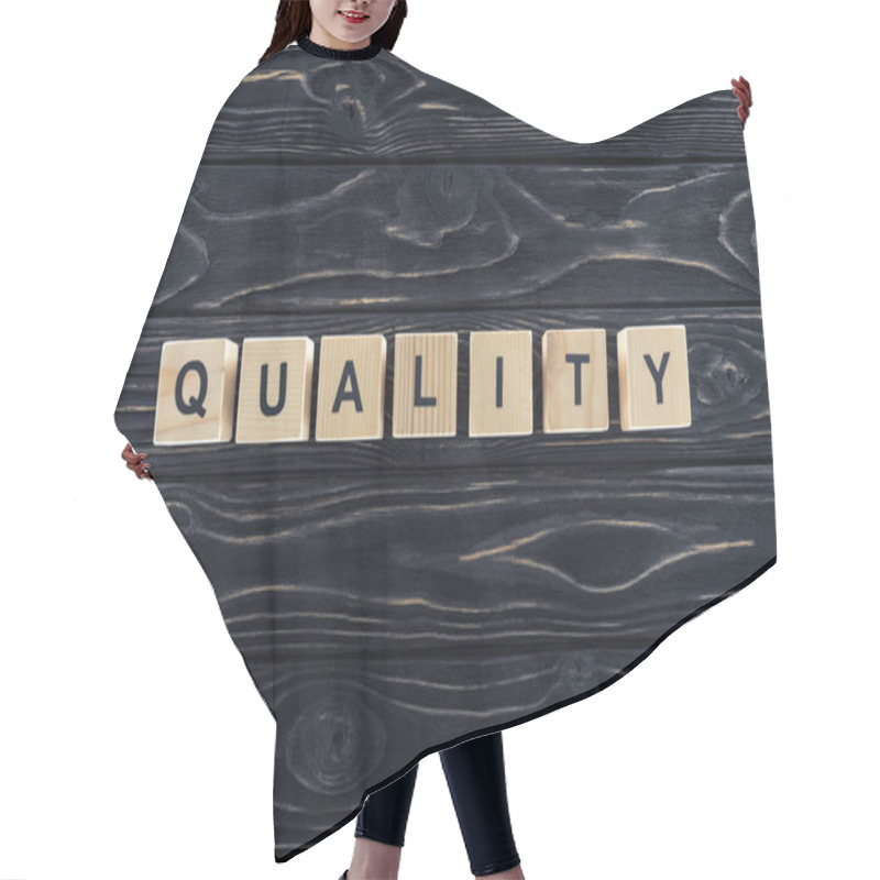 Personality  Top View Of Word Quality Made Of Wooden Blocks On Dark Wooden Tabletop Hair Cutting Cape