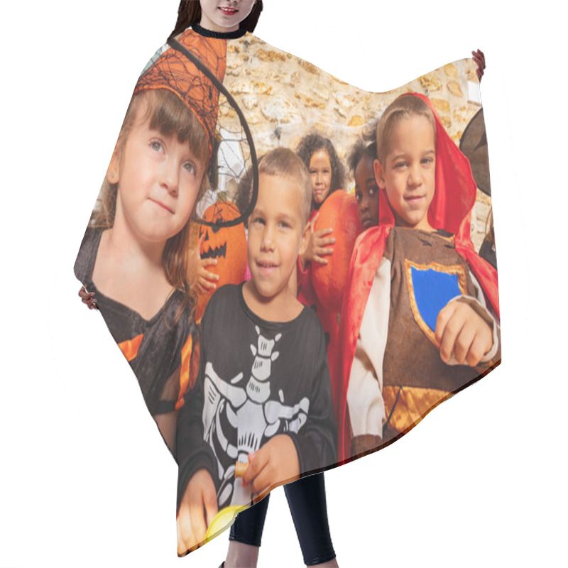 Personality  Portrait Of A Boy In The Group Of Halloween Costume Dressed Kids Standing Together With Buckets Of Candies Hair Cutting Cape