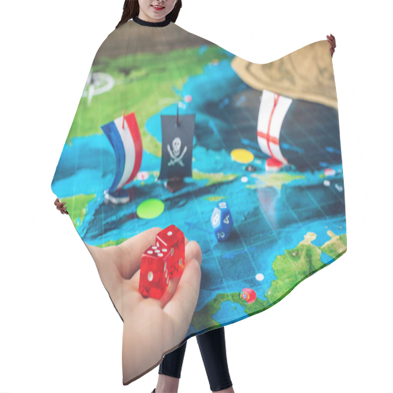 Personality  Hand Throwing Red Dice On The World Map Of The Playing Field Handmade Board Games With A Pirate Ship Hair Cutting Cape