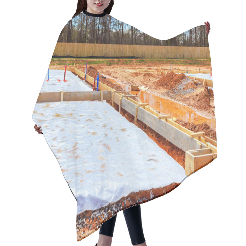 Personality  Groundwork Is Underway At Residential Construction Site, Featuring Wooden Frames Protective Covering Spread Across Foundation. Hair Cutting Cape