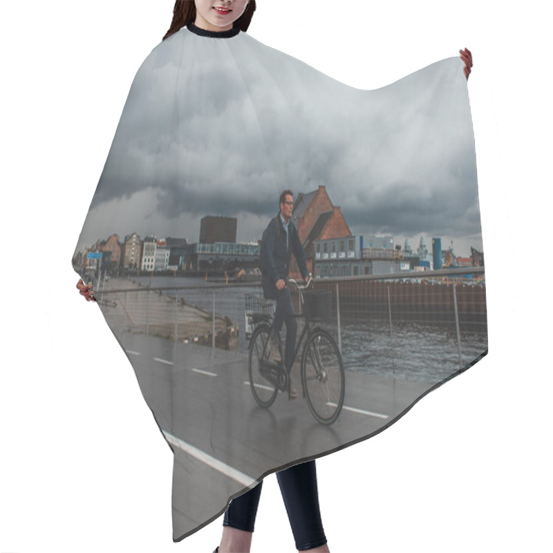 Personality  COPENHAGEN, DENMARK - APRIL 30, 2020: Man Riding Bicycle On Urban Street With Cloudy Sky At Background  Hair Cutting Cape