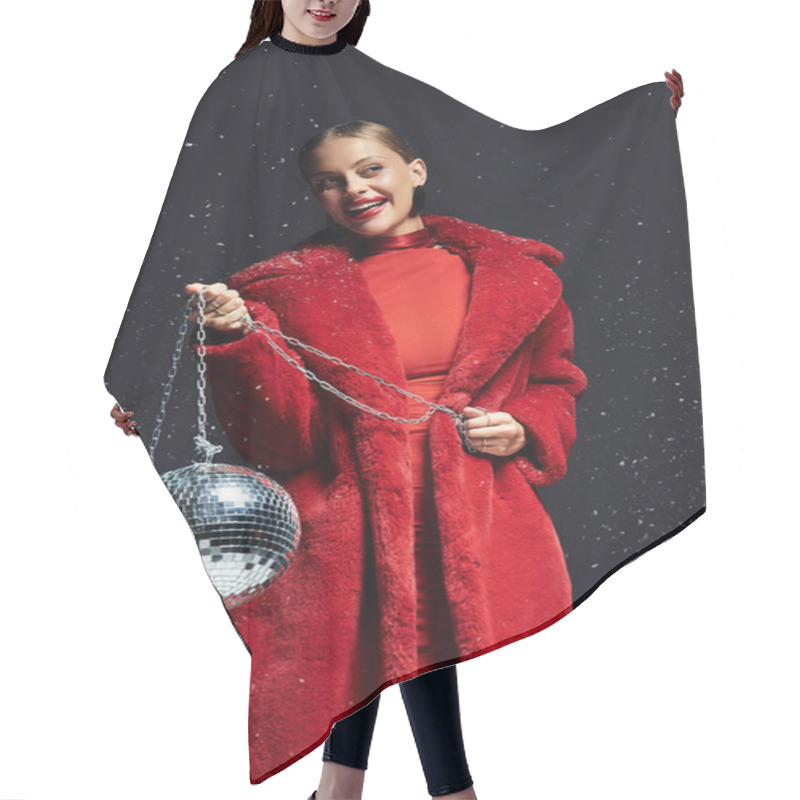 Personality  The Young Woman Radiates Joy, Dressed In A Striking Red Coat, Holding Shimmering Disco Balls. Hair Cutting Cape