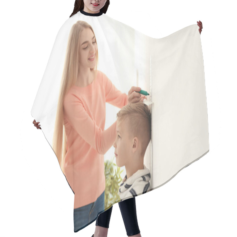 Personality  Young Woman Measuring Height Of Little Boy At Home Hair Cutting Cape