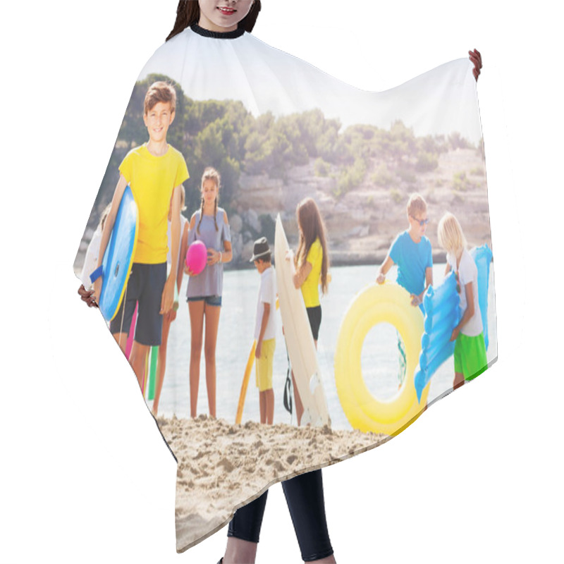 Personality  Boy Stand On The Sand Beach With Group Of Friends On Background Holding Swimming Boards And Inflatable Toys Hair Cutting Cape