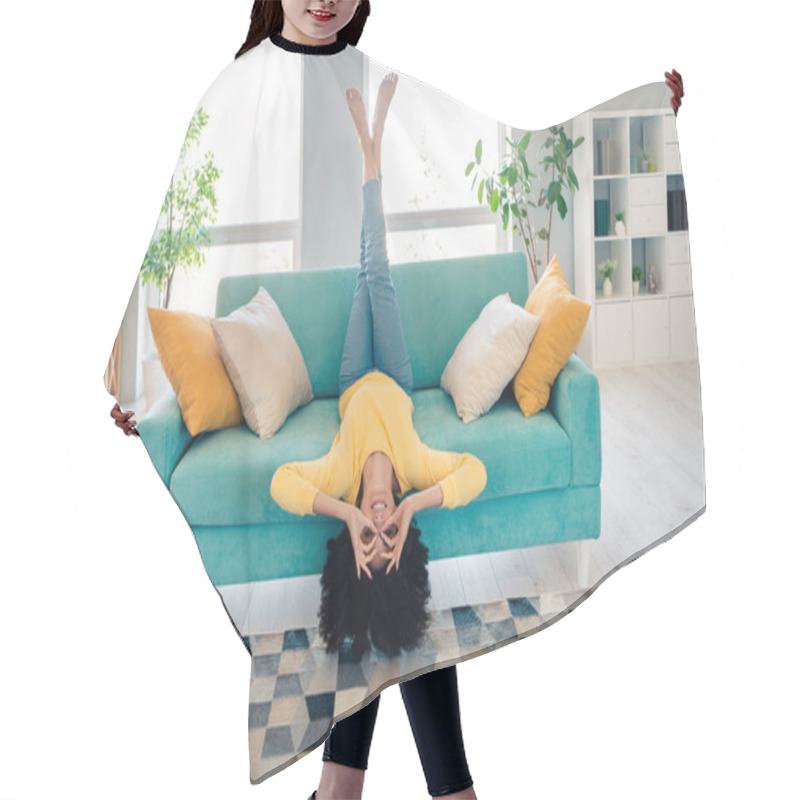 Personality  Full Body Photo Of Overjoyed Lady Arms Fingers Make Binoculars Eyes Sit Couch Upside Down Living Room Indoors. Hair Cutting Cape