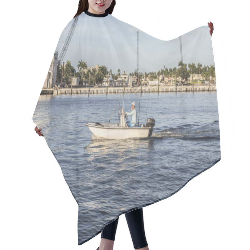 Personality  FORT LAUDERDALE, USA - AUG 20, 2014: Man In Boat For Fishing By Hair Cutting Cape