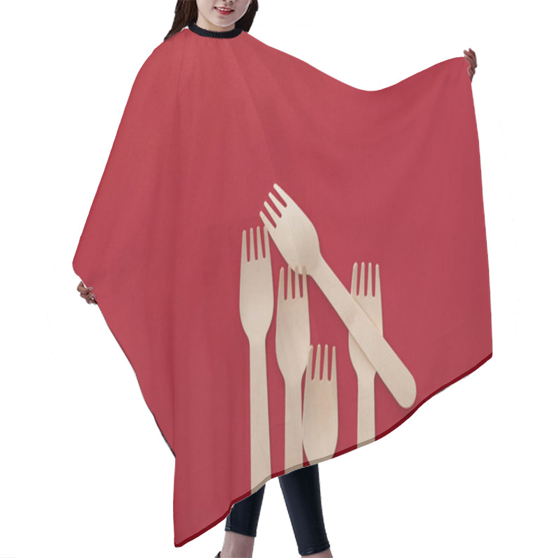 Personality  Top View Of Natural Wooden Forks On Red Background With Copy Space Hair Cutting Cape