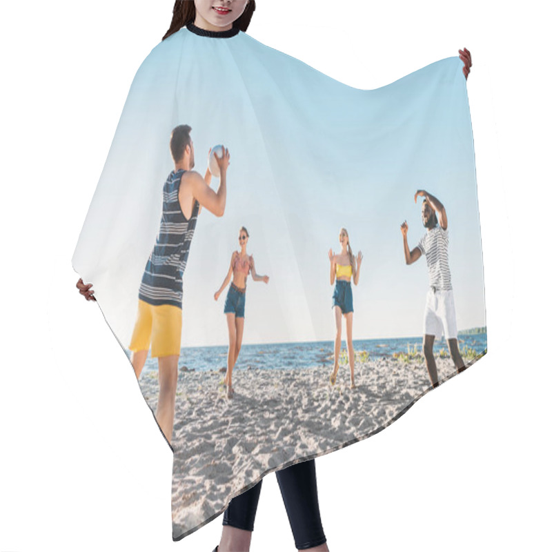 Personality  Happy Young Multiethnic Friends Playing Beach Volleyball  Hair Cutting Cape