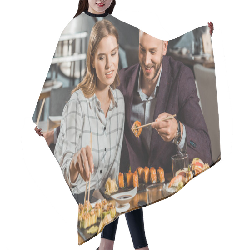 Personality  Happy Smiling Young Adult Couple Eating Sushi Rolls In Restaurant  Hair Cutting Cape