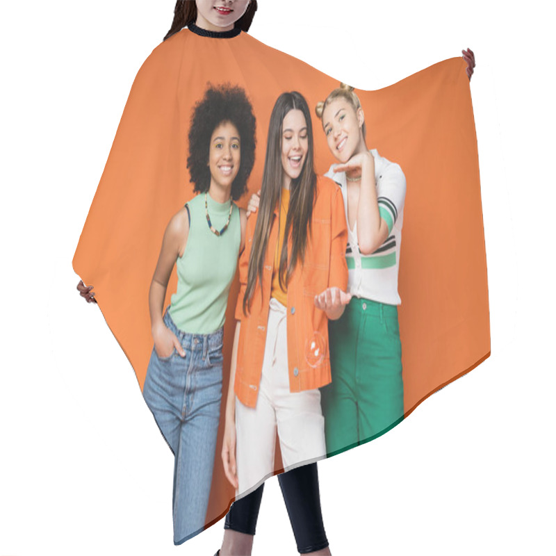 Personality  Cheerful And Trendy Multiethnic Teenage Girls With Bold Makeup And Casual Clothes Posing With Soap Bubbles On Orange Background, Teen Fashionistas With Impeccable Style Concept Hair Cutting Cape