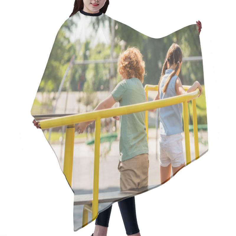 Personality  Back View Of Brother And Sister Having Fun On Carousel In Amusement Park Hair Cutting Cape