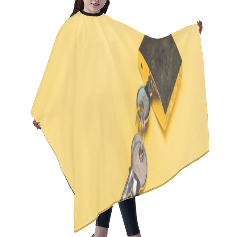 Personality  Panoramic Shot Of Metallic Padlock With Keys Isolated On Yellow Hair Cutting Cape