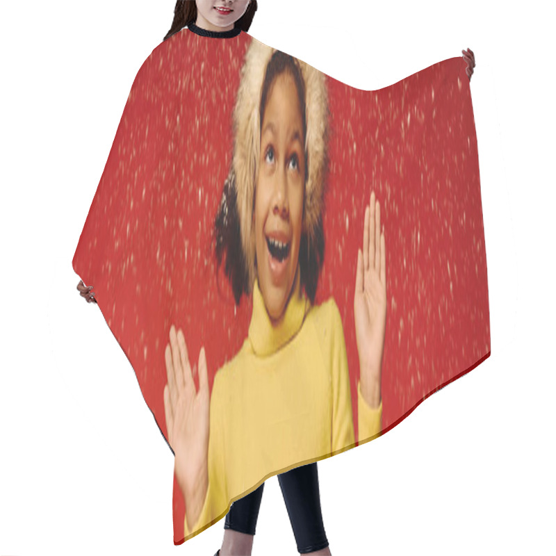 Personality  Girl Joyfully Celebrates The Holidays In A Bright Yellow Outfit Amidst Falling Snow. Hair Cutting Cape