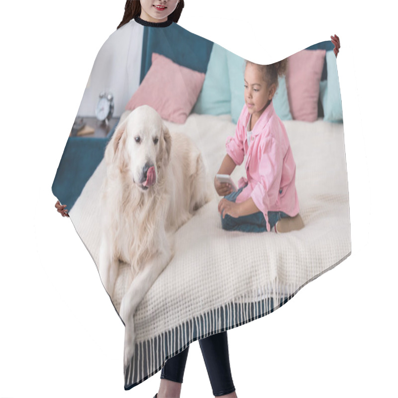 Personality  Cute African American Kid Sitting On The Bed With Smartphone And Golden Retriever Hair Cutting Cape