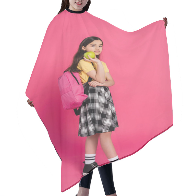 Personality  Full Length, Brunette Schoolgirl Standing With Backpack And Holding Green Apple, Pink Background Hair Cutting Cape