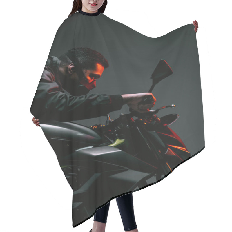 Personality  Side View Of Mixed Race Cyberpunk Player In Mask Riding Motorcycle On Grey  Hair Cutting Cape