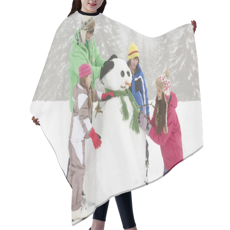 Personality  Group Of Children Building Snowman On Ski Holiday In Mountains Hair Cutting Cape