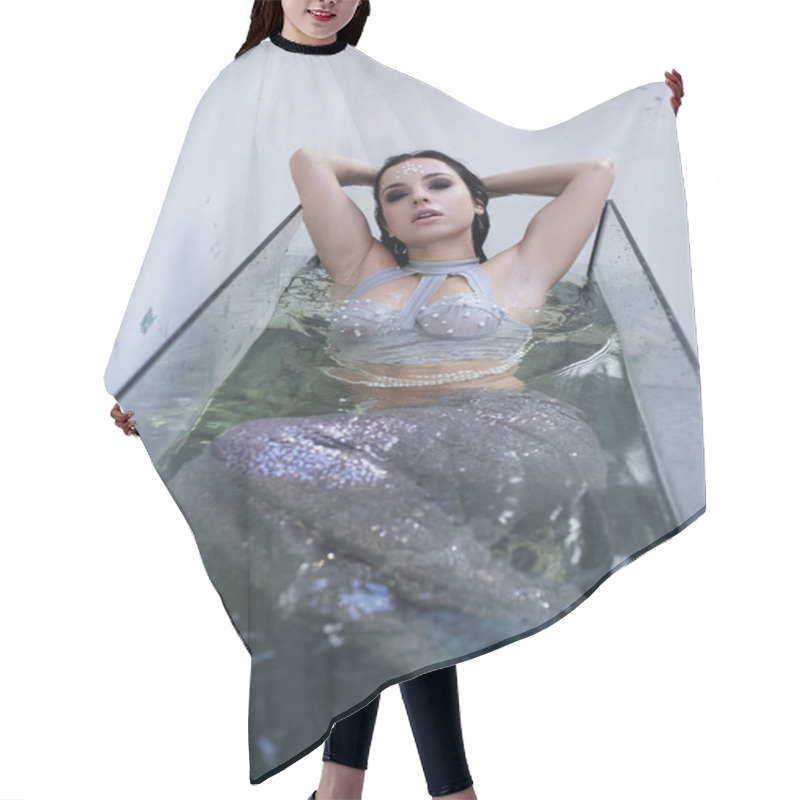 Personality  A Young Woman, Dressed As A Mermaid, Reclines In A Water-filled Tank, Her Gaze Captivating. Hair Cutting Cape