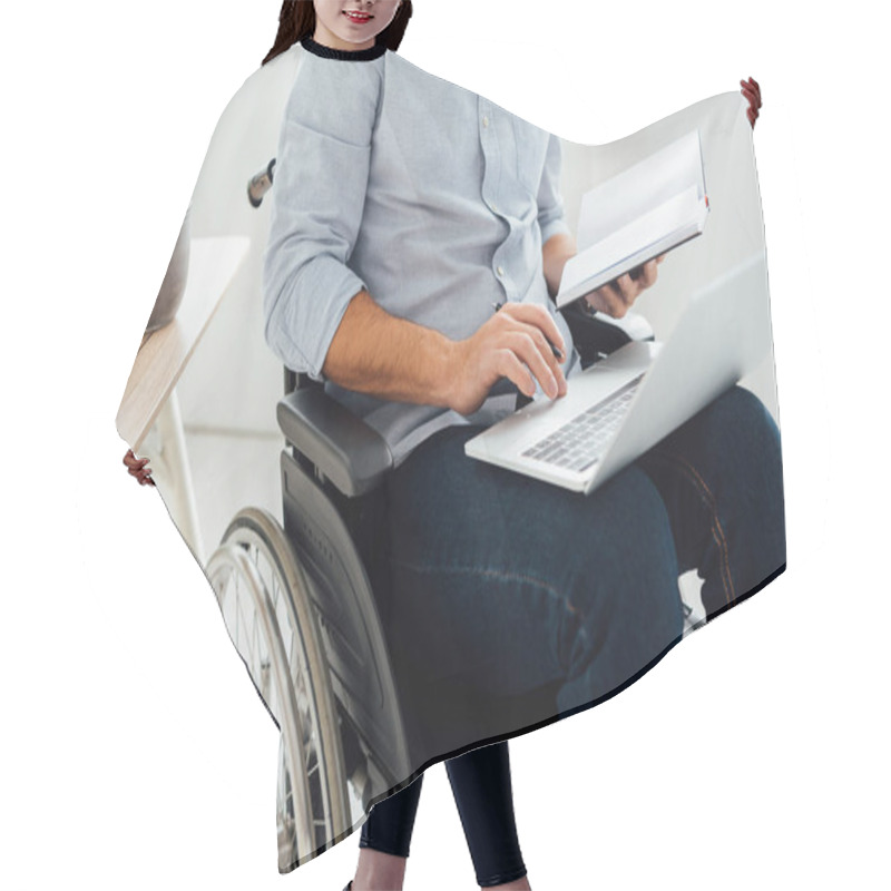 Personality  Cropped View Of Man In Wheelchair Holding Notebook And Laptop Hair Cutting Cape