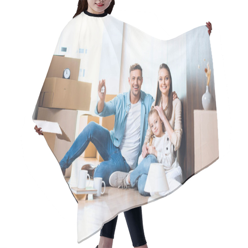 Personality  Happy Man Sitting On Floor With House Shaped Key Chain Near Attractive Wife And Daughter  Hair Cutting Cape