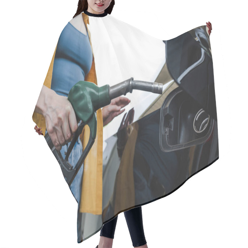 Personality  Cropped View Of Woman Holding Fueling Nozzle Near Auto On Gas Station  Hair Cutting Cape