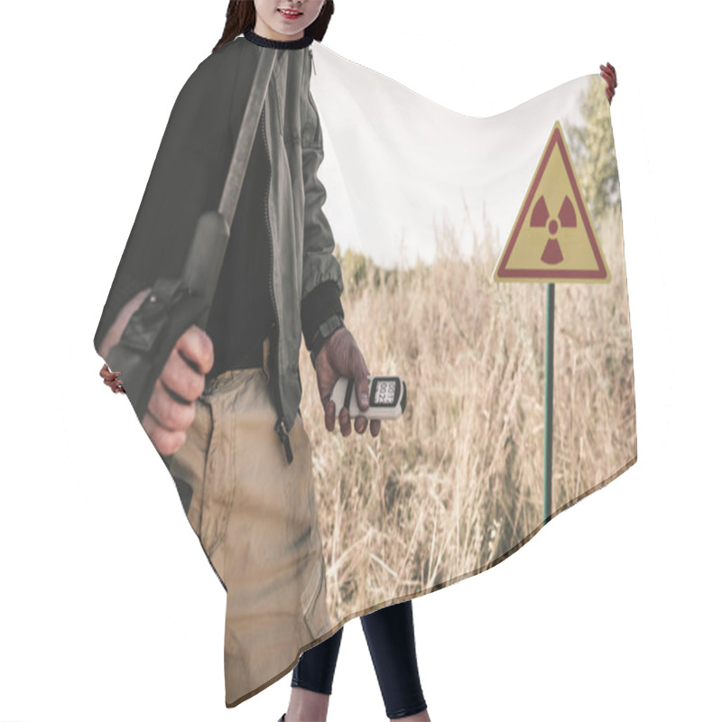 Personality  Cropped View Of Man Holding Radiometer And Gun Near Toxic Symbol, Post Apocalyptic Concept Hair Cutting Cape