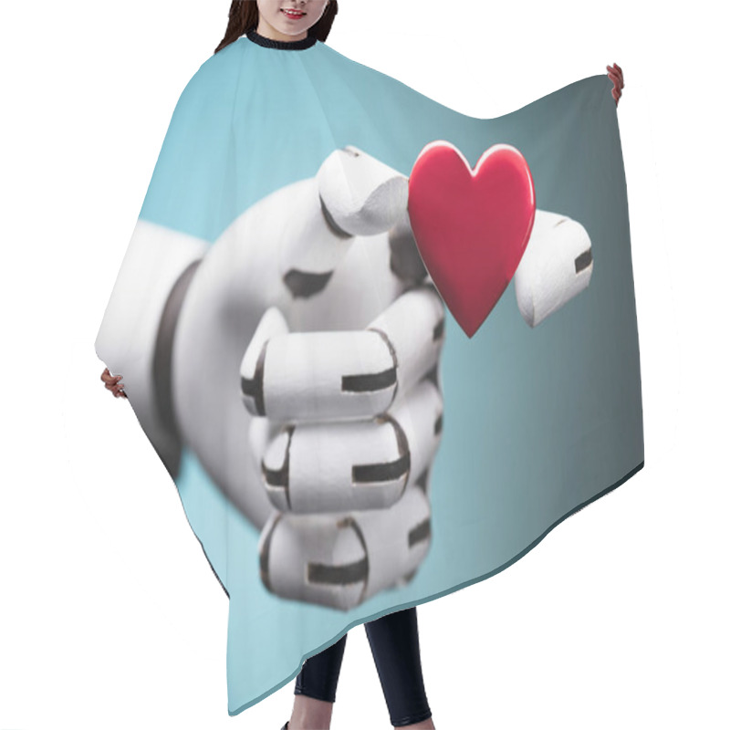 Personality  Close-up Of A Robot's Hand Holding Red Heart Hair Cutting Cape