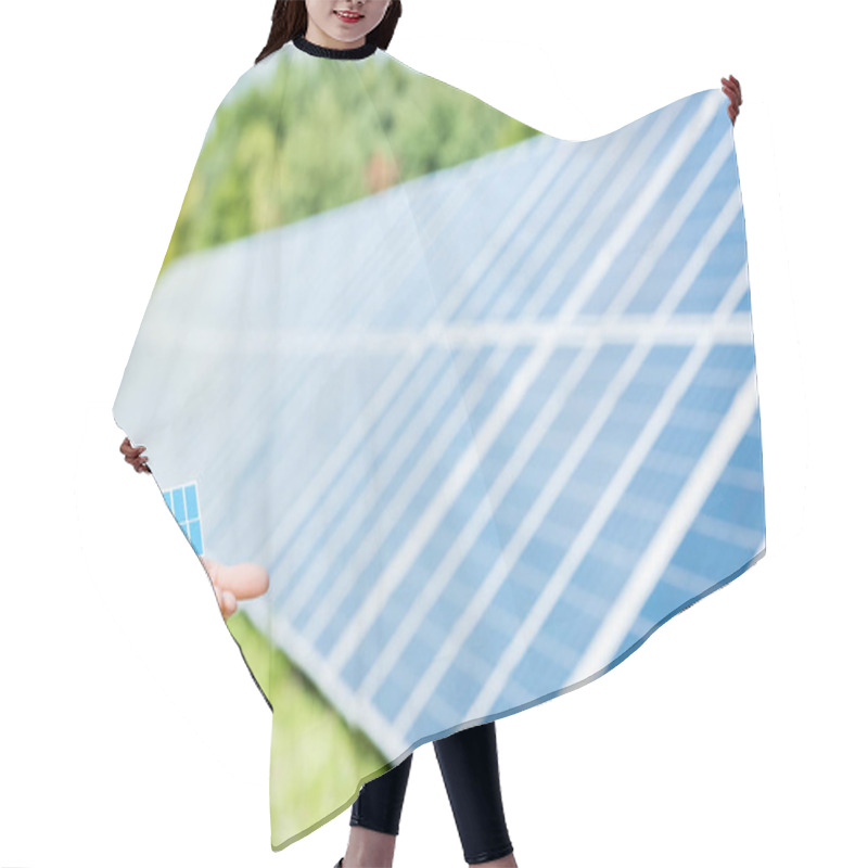 Personality  Cropped View Of Woman Holding Solar Battery Model Outside  Hair Cutting Cape