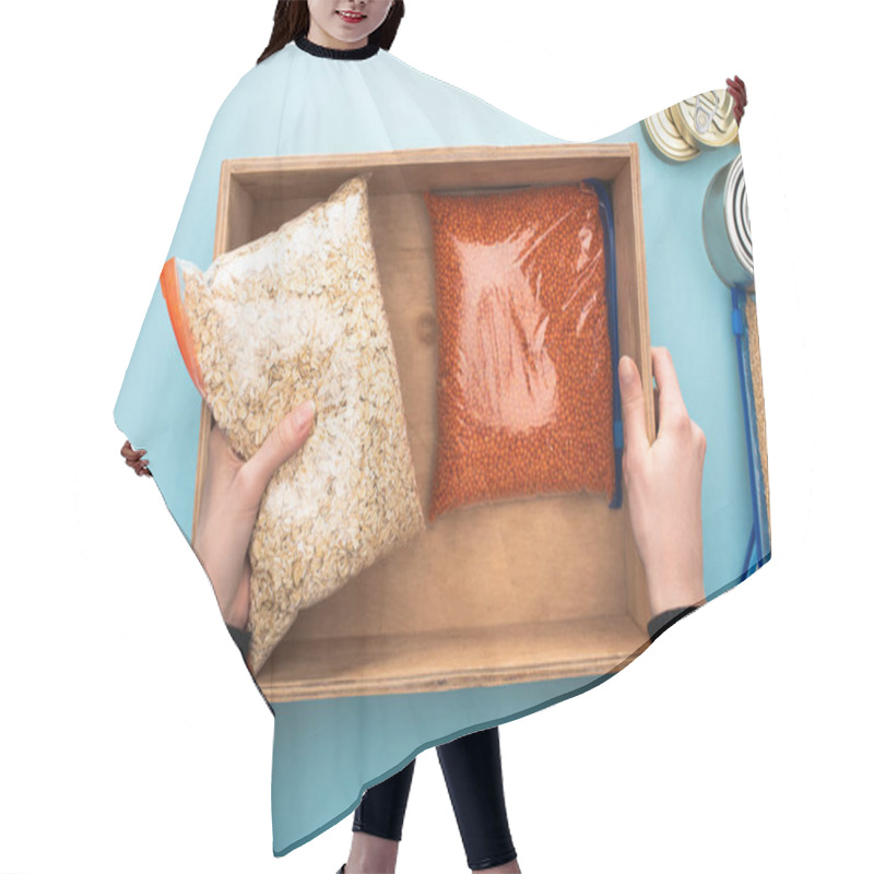 Personality  Cropped View Of Woman Packing Groats In Wooden Box On Blue Background, Food Donation Concept Hair Cutting Cape