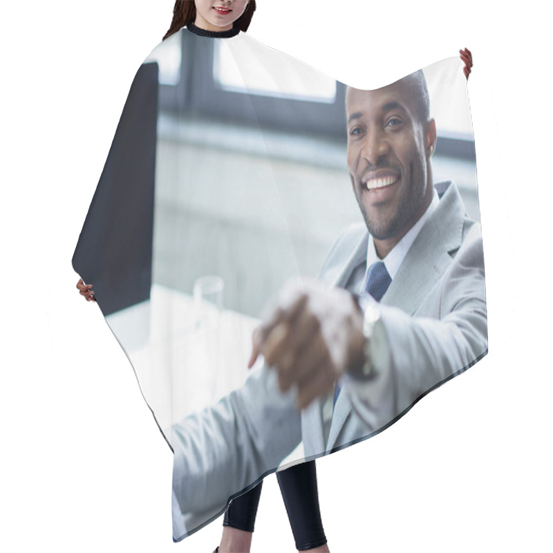 Personality  Smiling African American Businessman With Newspaper Pointing Away At Workplace Hair Cutting Cape