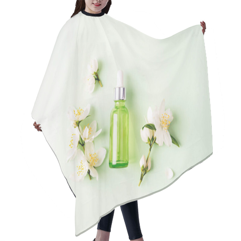 Personality  Green Cosmetic Serum Bottle And White Jasmine Flowers. Natural Cosmetics, Skin Care Concept. Top View, Flat Lay. Hair Cutting Cape