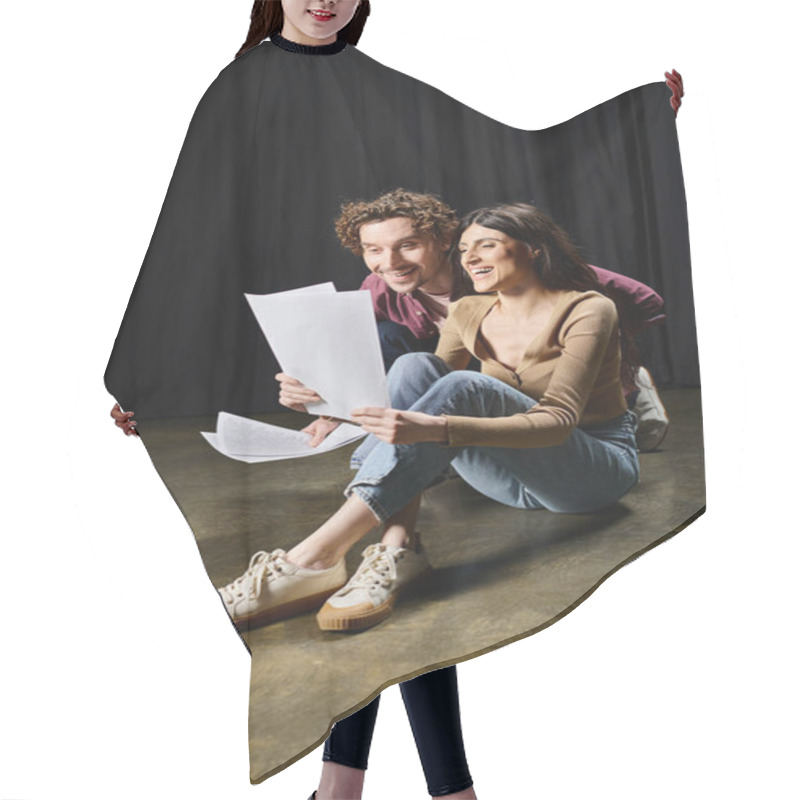 Personality  A Man And Woman Share Ideas While Holding Papers On The Ground. Hair Cutting Cape