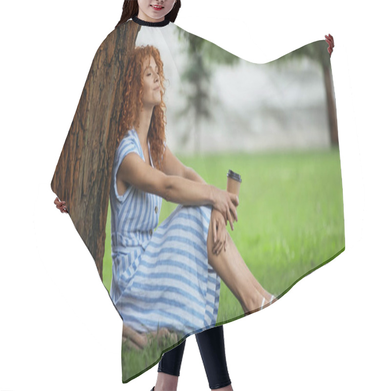 Personality  Smiling Redhead Woman In Blue Dress Sitting Under Tree Trunk And Holding Coffee To Go  Hair Cutting Cape