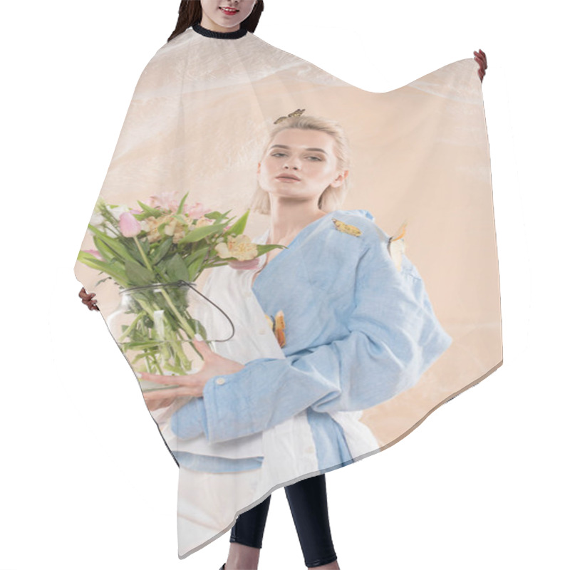 Personality  Attractive Girl Standing With Butterflies On Eco Clothing And Holding Glass Vase With Flowers On Beige Background, Environmental Saving Concept  Hair Cutting Cape