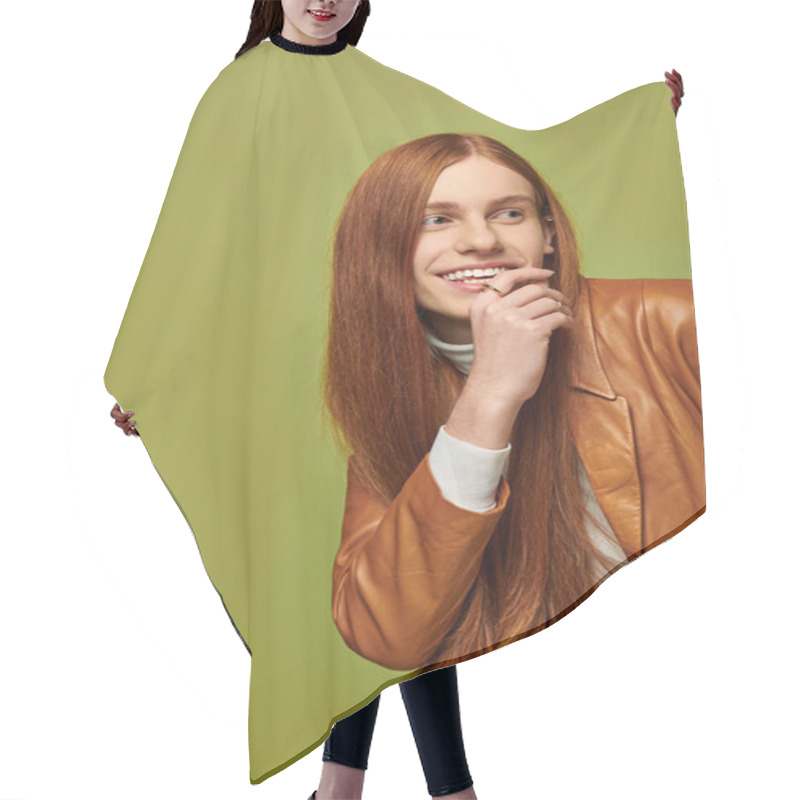 Personality  A Young Emotional Man With Long Red Hair Smiles While Playfully Posing For A Striking Photo. Hair Cutting Cape