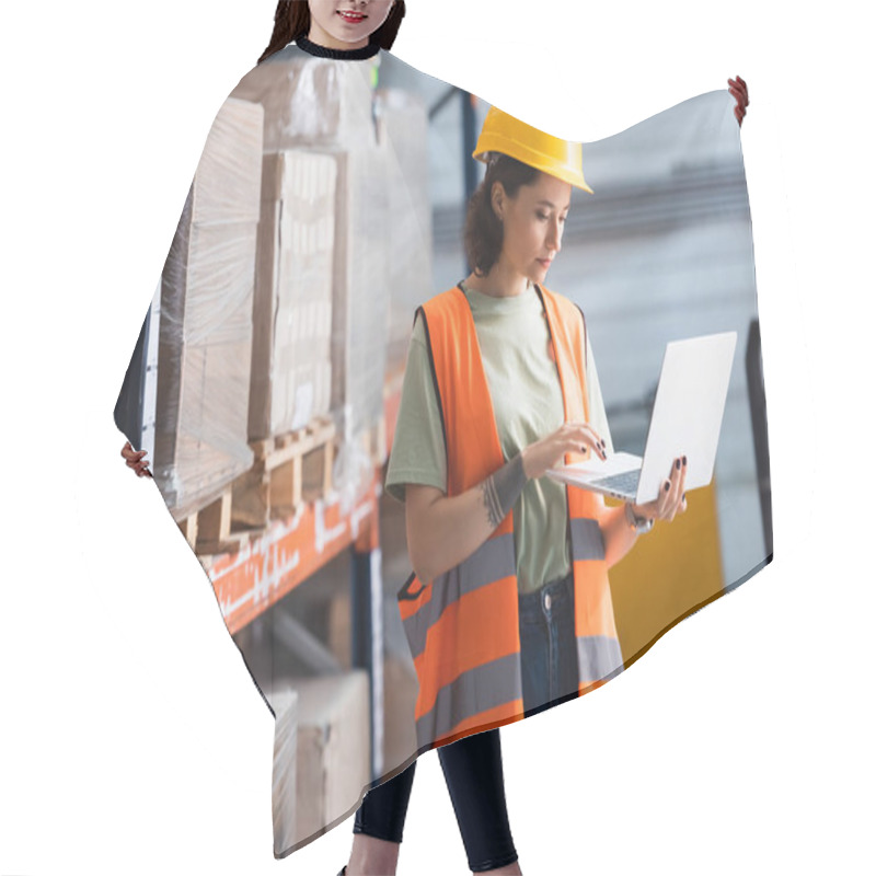 Personality  Female Worker In Hard Hat And Safety Vest Using Laptop While Checking Cargo In Warehouse, Management Hair Cutting Cape