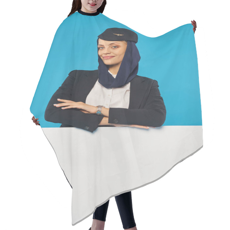 Personality  Arabian Airlines Stewardess With Folded Arms Smiling At Camera Near Empty Poster On Blue Backdrop Hair Cutting Cape