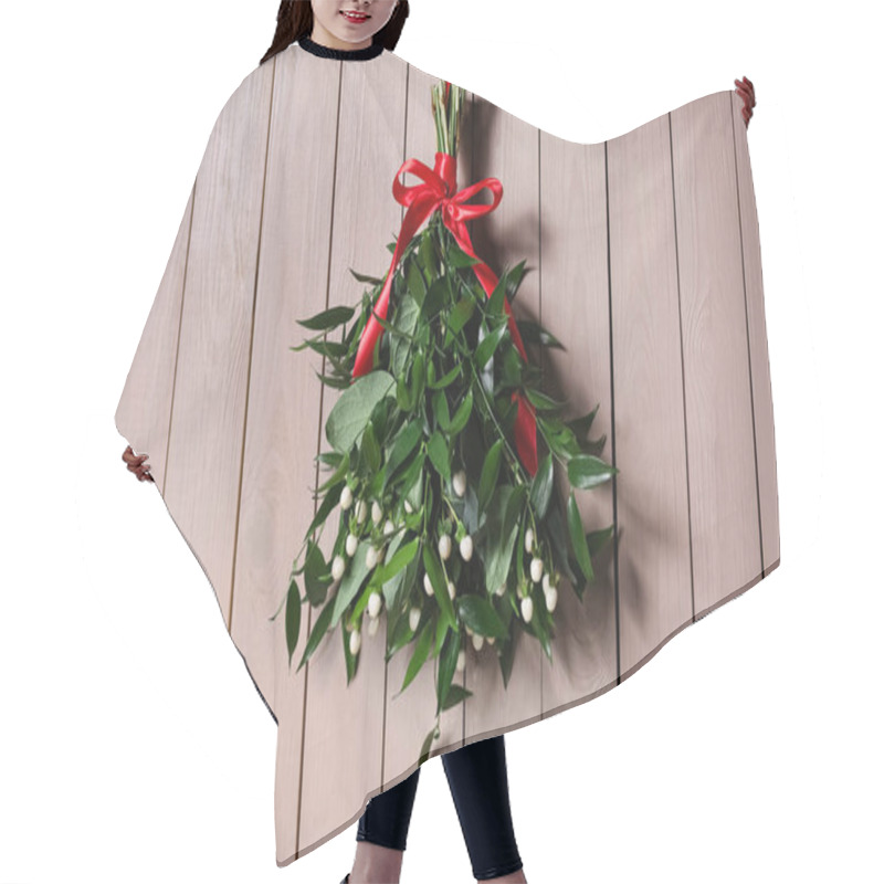 Personality  Mistletoe Bunch With Red Bow Hanging On Wooden Wall. Traditional Christmas Decor Hair Cutting Cape