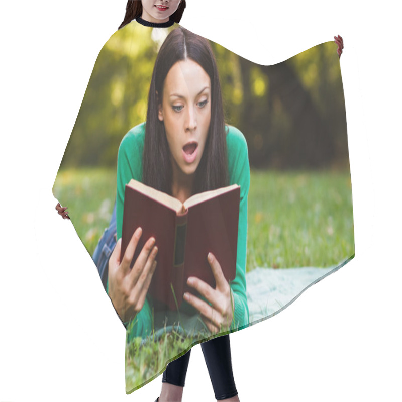 Personality  Woman Is Surprised About Something She Had Read In A Book Hair Cutting Cape