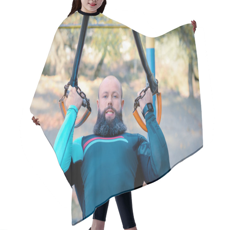 Personality  Muscular Bearded Man Training With Straps Hair Cutting Cape