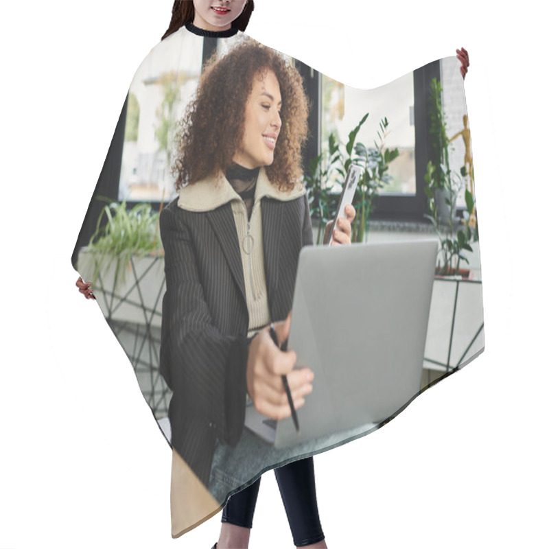 Personality  A Woman Engages With Her Phone While Focused On Her Laptop Surrounded By Plants. Hair Cutting Cape