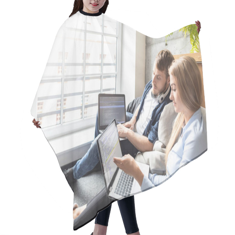 Personality  Man And Woman Colleagues Sitting Together And Using Laptops Hair Cutting Cape