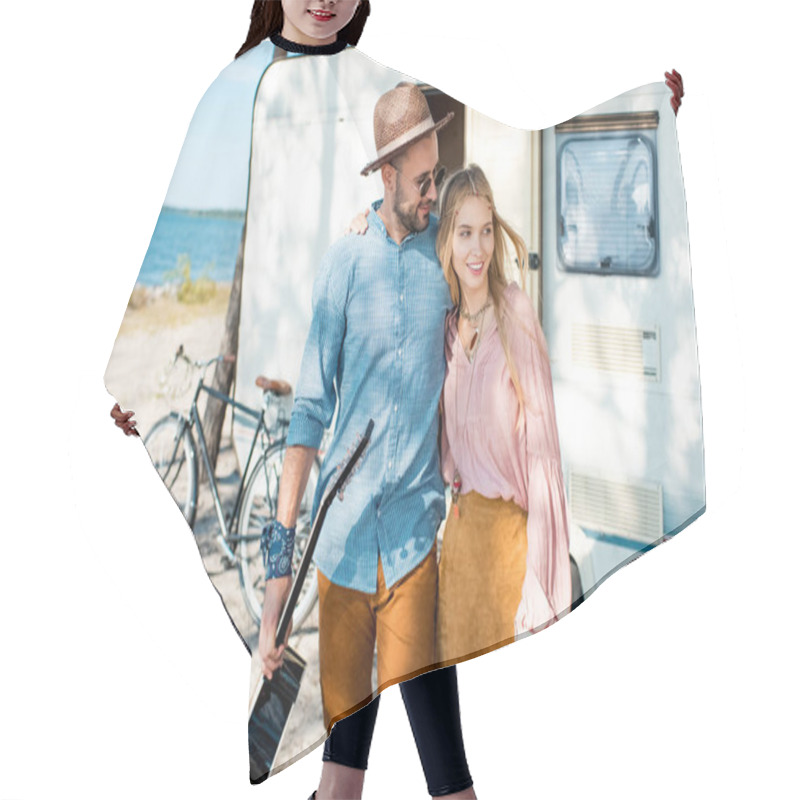 Personality  Hippie Girl And Man Hugging And Walking With Guitar Near Trailer Hair Cutting Cape