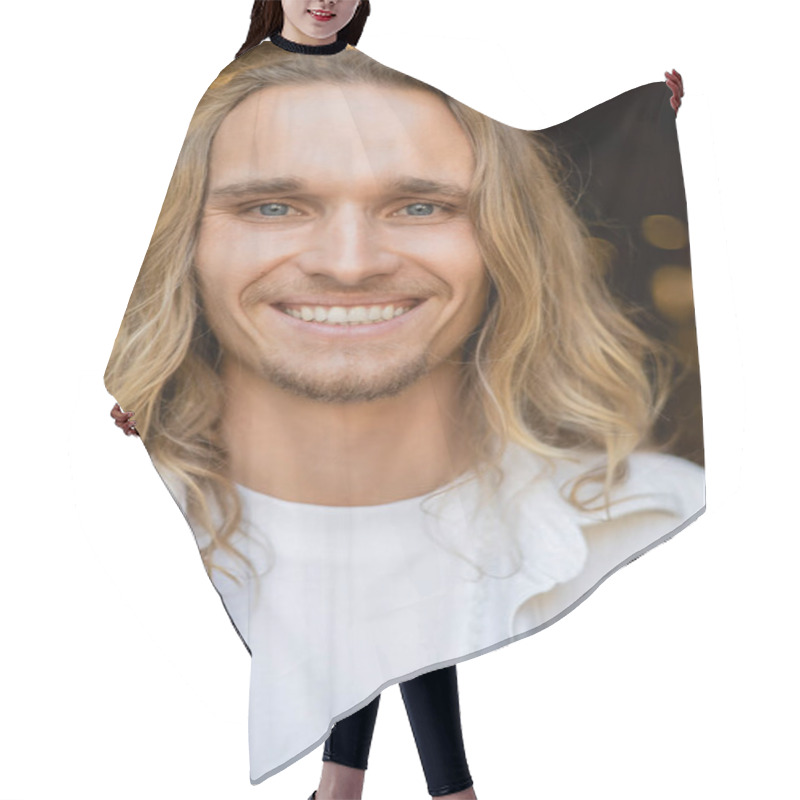 Personality  Portrait Of Young And Carefree Yoga Man With Long Fair Hair Looking At Camera Outdoors Hair Cutting Cape