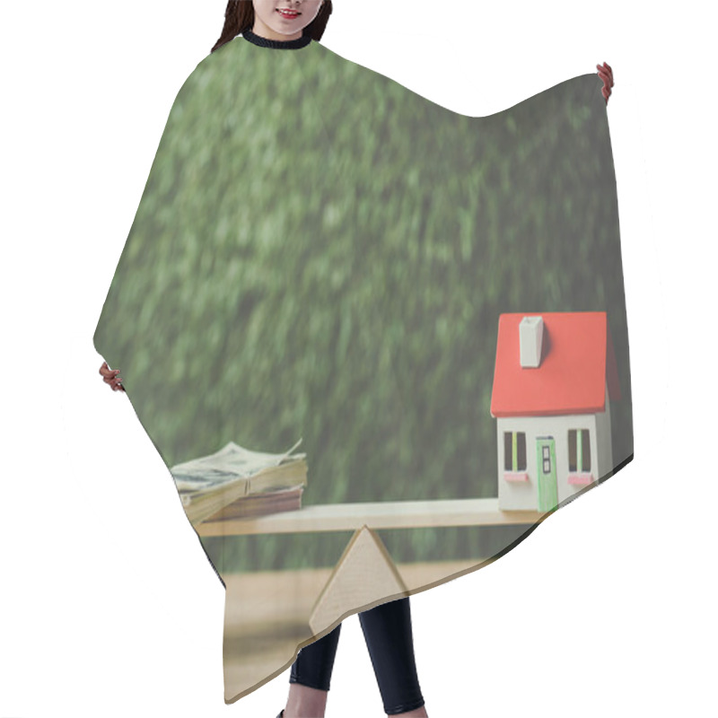 Personality  House Model And Dollar Banknotes Balancing On Seesaw On Green Background Hair Cutting Cape