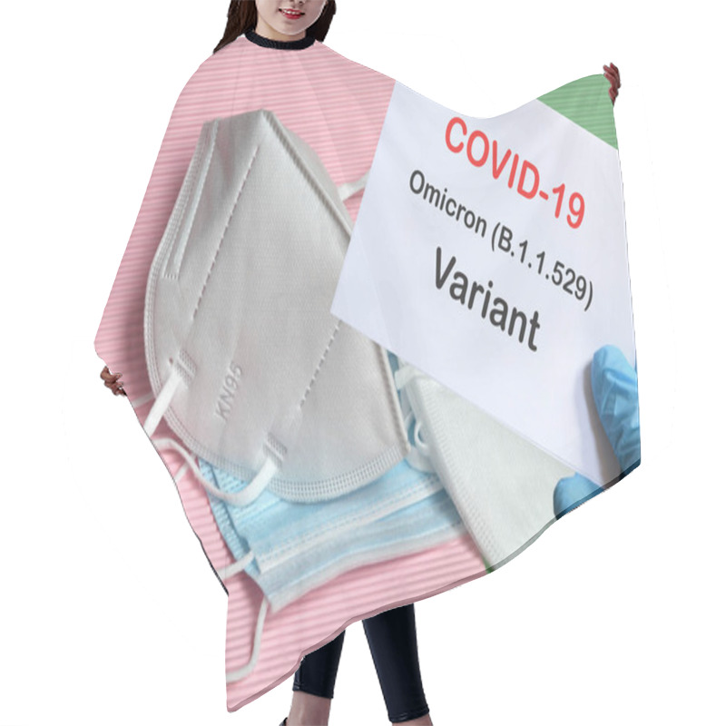 Personality  Doctor's Hand In Blue Glove With White Paper And Text Covid-19 Omicron Variant With Various Protection Masks On Background. COVID-19 Omicron Variant Strain Protection Concept. Hair Cutting Cape