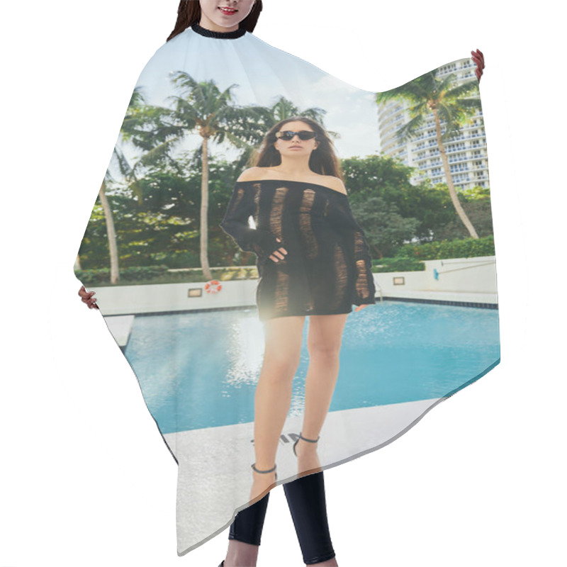 Personality  Sexy Brunette Woman In Black Knitted Dress And Sunglasses Posing Against Palm Trees And Modern Hotel Building In Miami, Vacation, Outdoor Swimming Pool With Shimmering Water In Luxury Resort Hair Cutting Cape