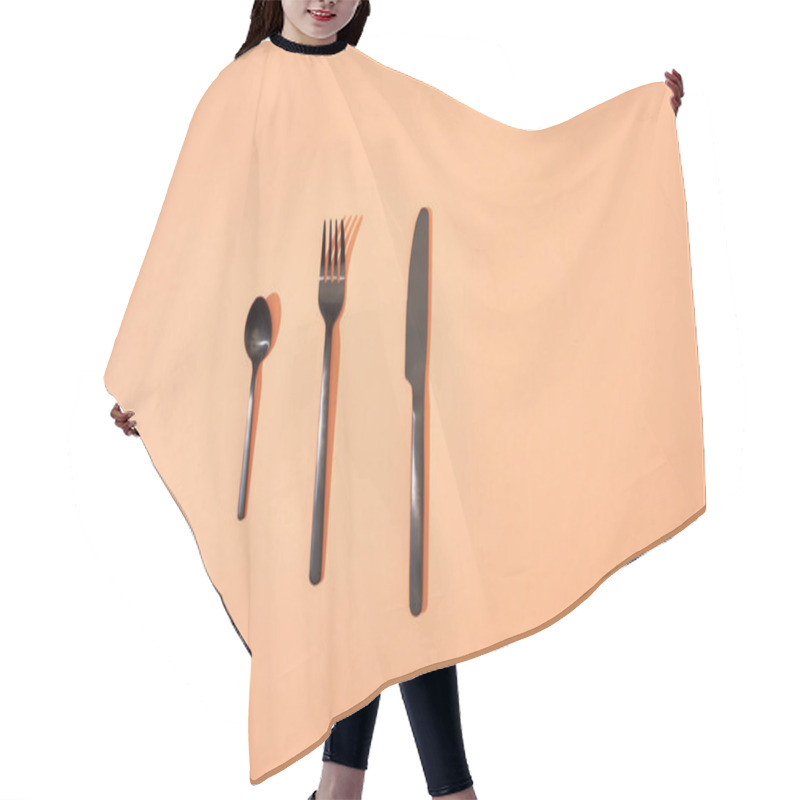 Personality  Top View Of Metal Shiny Black Fork, Spoon And Knife On Orange Background Hair Cutting Cape